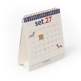 Calendário de Mesa Cicero 2027 - Petit Moldura